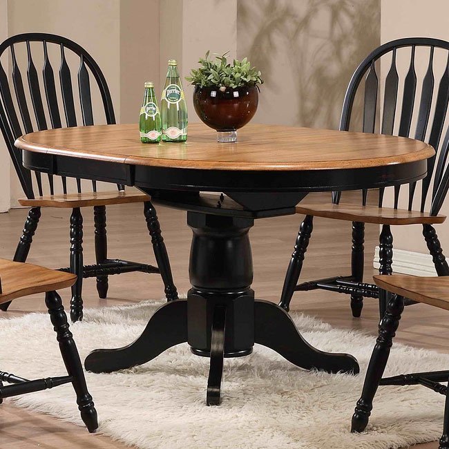 oak dining table with black chairs